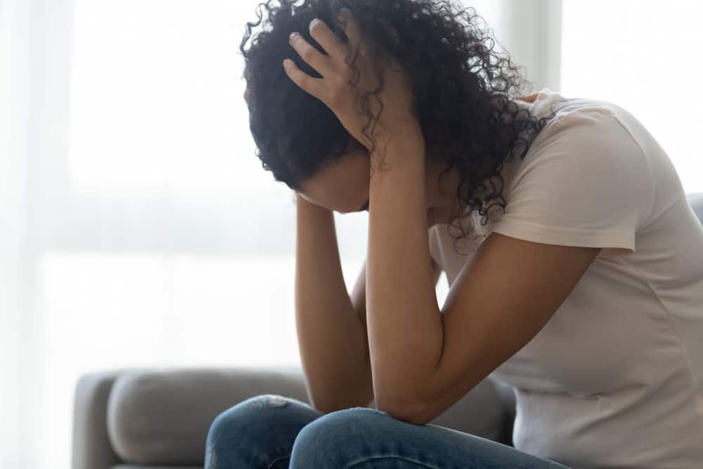 Sad,Hopeless,Young,Black,Woman,Sit,Alone,At,Home,Feeling