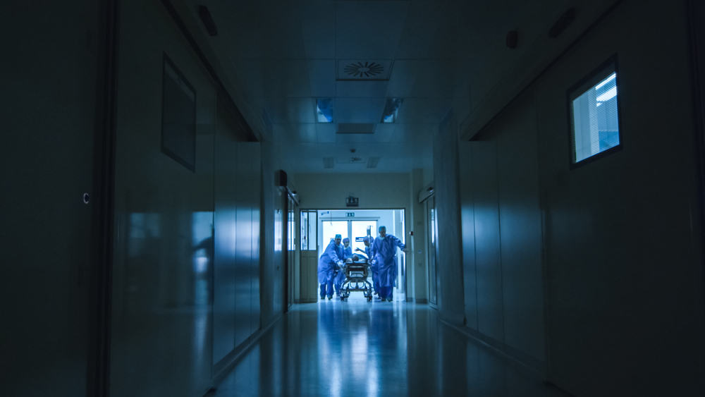 Hospital,Emergency,Team,Carrying,Stretcher,With,Patient,Through,Dark,Hospital plan