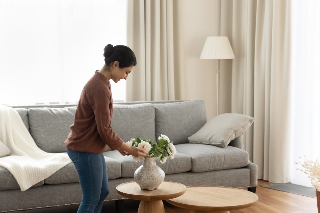 Smiling,Young,Indian,Ethnicity,Woman,Homeowner,Putting,Beautiful,Flowers,In minimalismo
